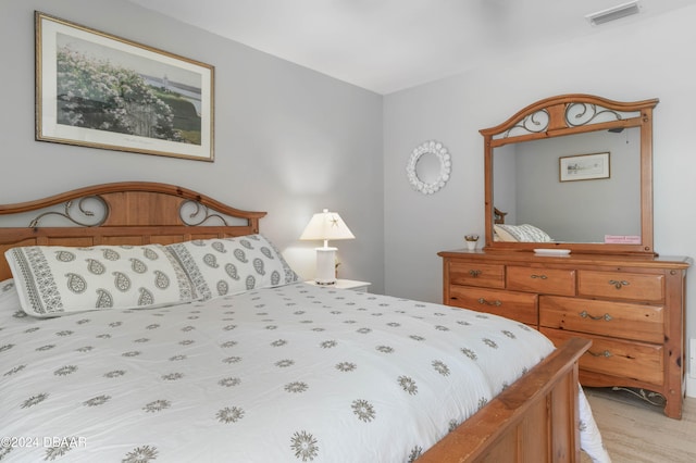 bedroom with light hardwood / wood-style floors