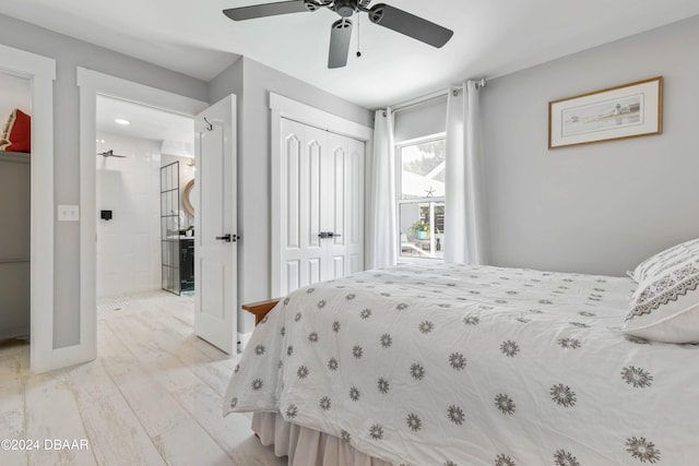 bedroom with ceiling fan, a closet, and light hardwood / wood-style flooring