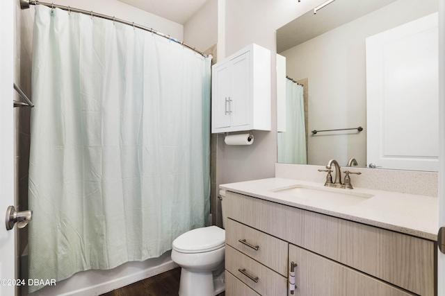 full bathroom with wood-type flooring, vanity, toilet, and shower / bath combination with curtain