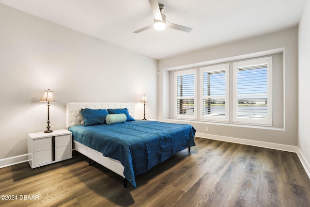 bedroom featuring dark hardwood / wood-style flooring and ceiling fan