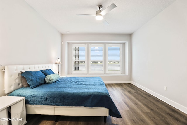 bedroom with wood-type flooring and ceiling fan