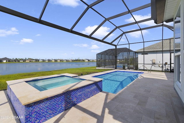 view of swimming pool with a patio area, a water view, a lanai, and an in ground hot tub