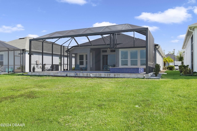 back of property with a lanai and a lawn