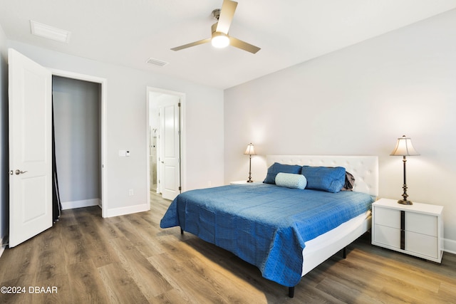 bedroom featuring hardwood / wood-style flooring and ceiling fan