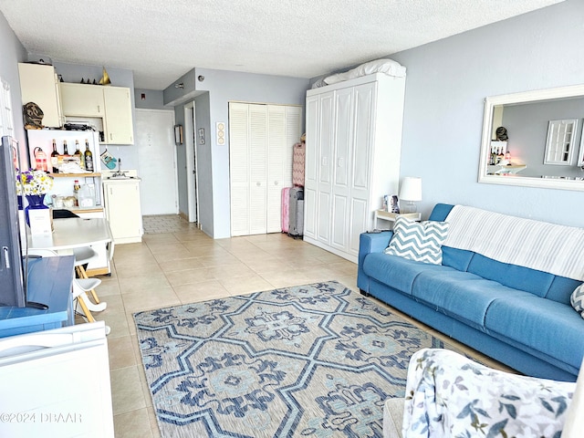 tiled living room with a textured ceiling