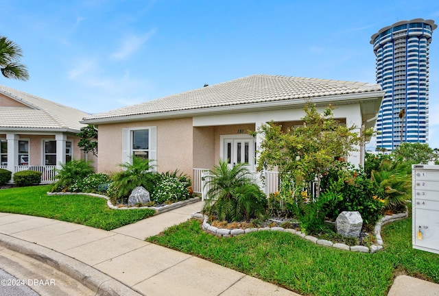 view of front of home with a front lawn