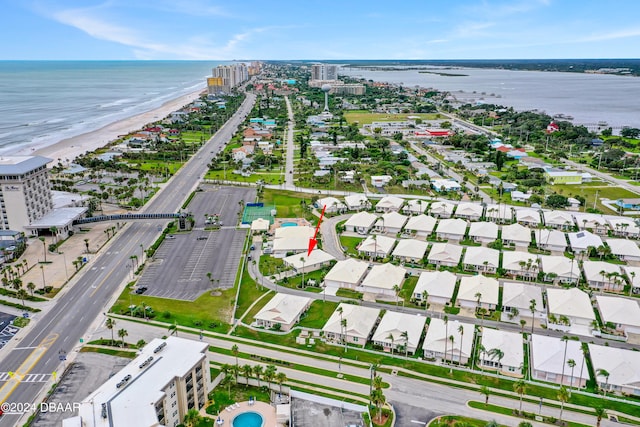 bird's eye view with a view of the beach and a water view