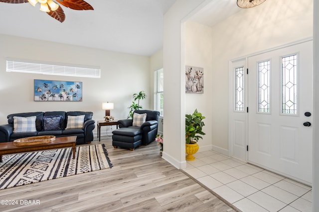 entryway featuring ceiling fan, a healthy amount of sunlight, and light wood-type flooring