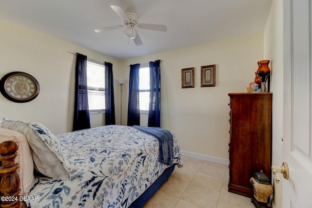 tiled bedroom with ceiling fan