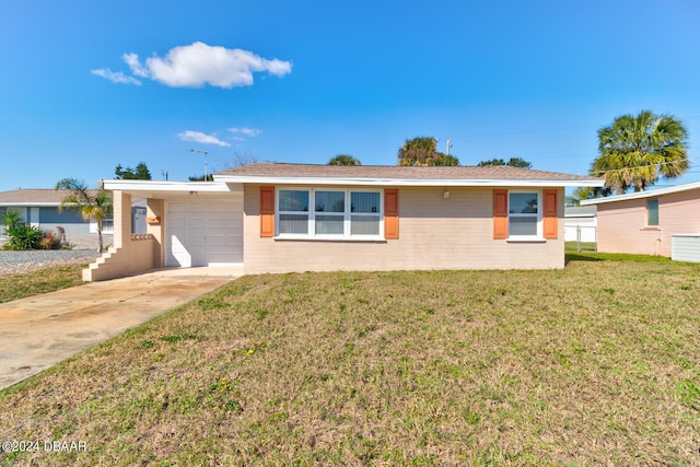 37 Poinsettia Dr, Ormond Beach, FL 32176 - ranch-style house with a front lawn, concrete driveway, and a garage