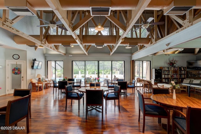 2 Fairways Cir Unit 2, Palm Coast, FL 32137 - dining area featuring a ceiling fan, high vaulted ceiling, and wood finished floors