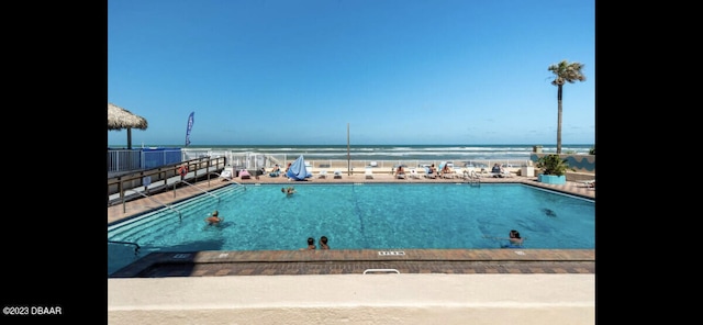 view of pool featuring a water view