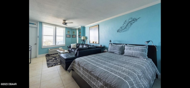 tiled bedroom featuring a textured ceiling, ceiling fan, and crown molding