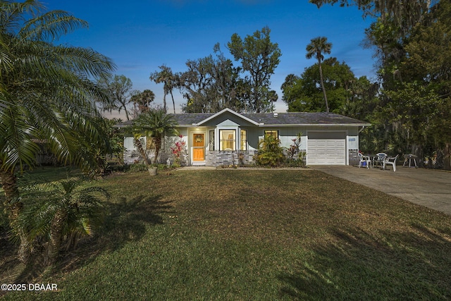 2249 Swoope Dr, New Smyrna Beach, FL 32168 - view of front facade featuring a garage, concrete driveway, and a front lawn