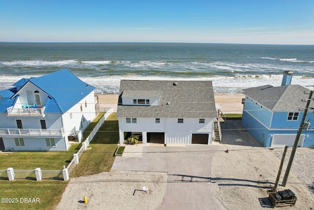 aerial view featuring a water view and a beach view