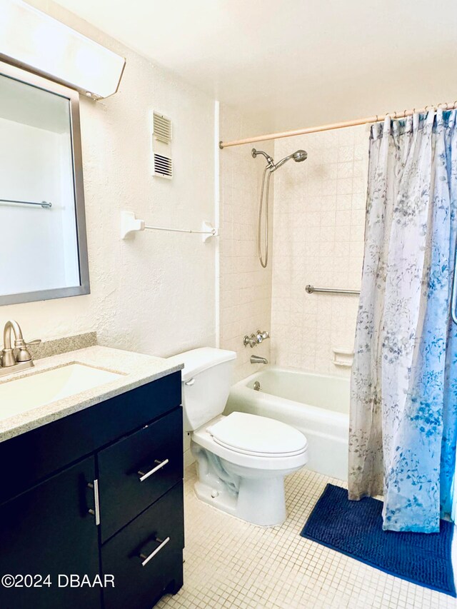 full bathroom with vanity, tile patterned floors, toilet, and shower / bathtub combination with curtain