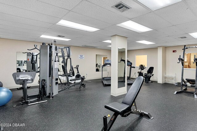 workout area featuring a drop ceiling