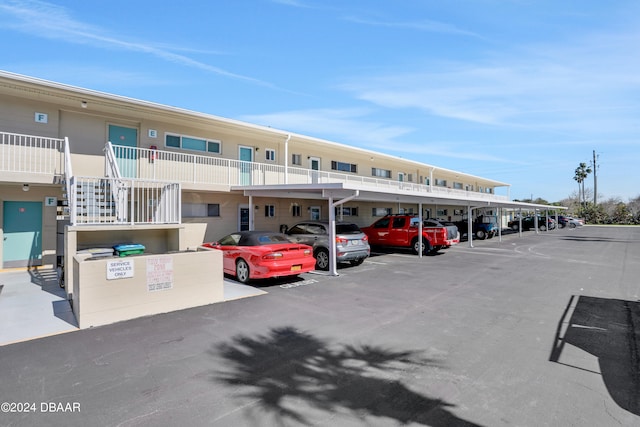 view of vehicle parking with a carport