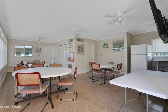 dining space featuring ceiling fan