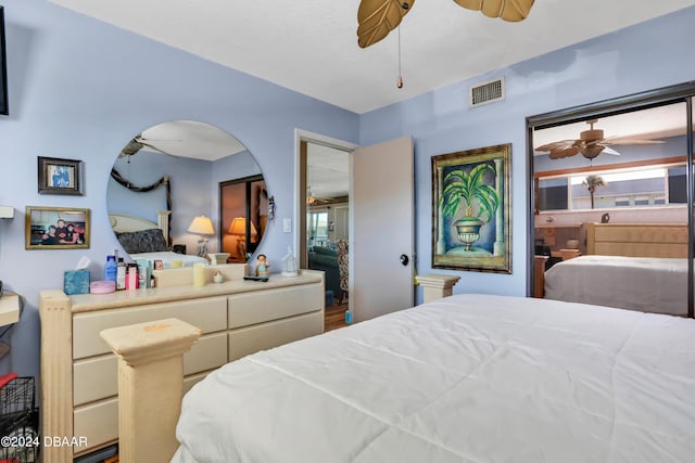 335 N Causeway Cswy Unit E220, New Smyrna Beach, FL 32169 - bedroom with ceiling fan and arched walkways