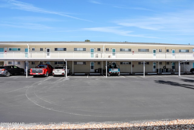 335 N Causeway Cswy Unit E220, New Smyrna Beach, FL 32169 - view of property featuring uncovered parking