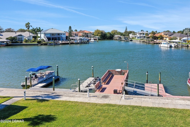 dock area featuring a yard and a water view