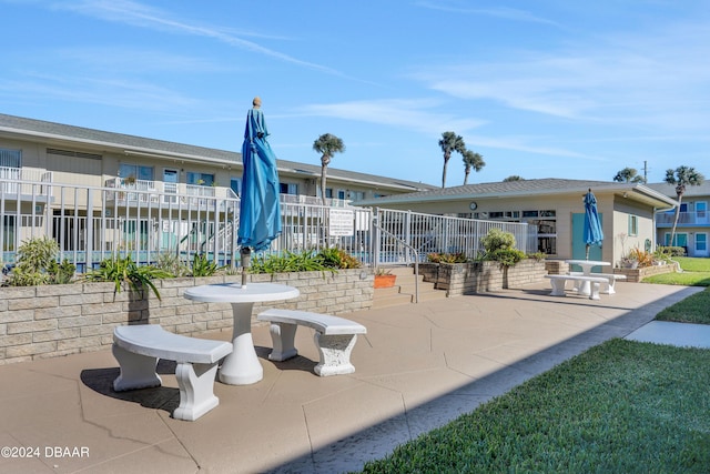 335 N Causeway Cswy Unit E220, New Smyrna Beach, FL 32169 - view of home's community featuring a patio area and fence