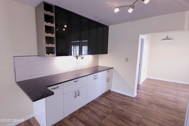 kitchen with white cabinets and pendant lighting