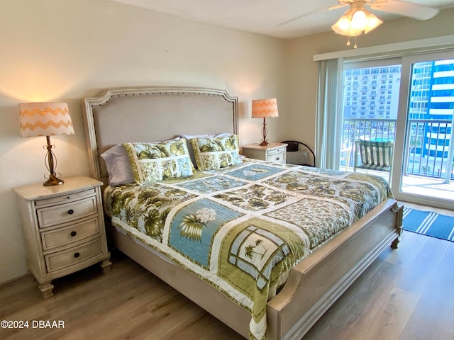 bedroom with access to outside, hardwood / wood-style flooring, and ceiling fan