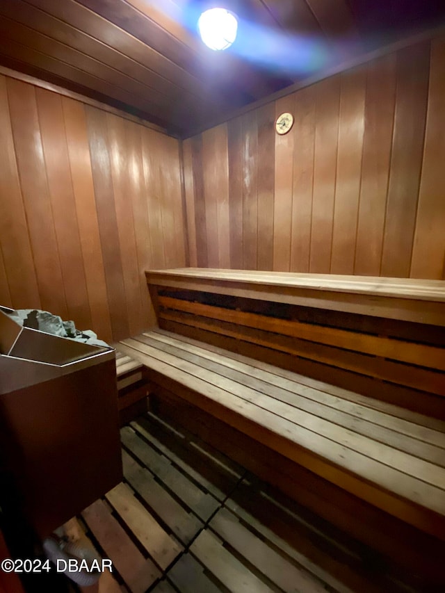 view of sauna featuring wood walls