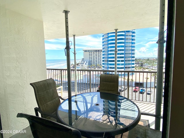 balcony featuring a water view