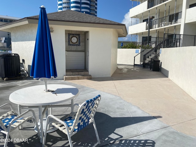 view of patio with central AC unit