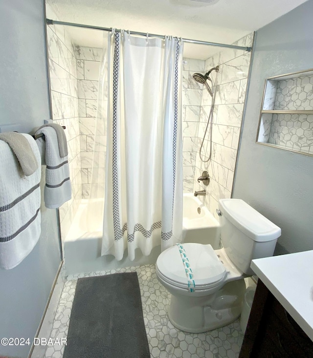 full bathroom with shower / bath combo, vanity, and toilet