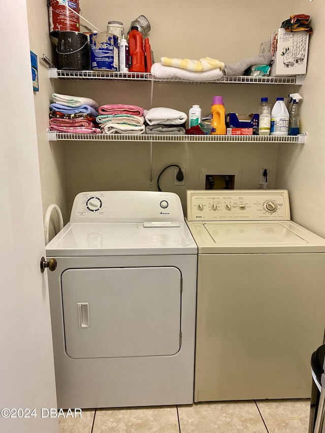 2615 S Atlantic Ave Unit 6G, Daytona Beach Shores, FL 32118 - washroom with washer and dryer and light tile patterned floors