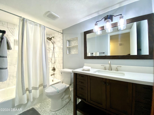 2615 S Atlantic Ave Unit 6G, Daytona Beach Shores, FL 32118 - bathroom featuring shower / tub combo, toilet, vanity, and tile patterned flooring