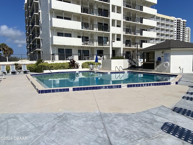 2615 S Atlantic Ave Unit 6G, Daytona Beach Shores, FL 32118 - community pool with fence and a patio