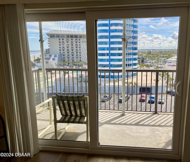 2615 S Atlantic Ave Unit 6G, Daytona Beach Shores, FL 32118 - entryway with a view of city, wood finished floors, and plenty of natural light