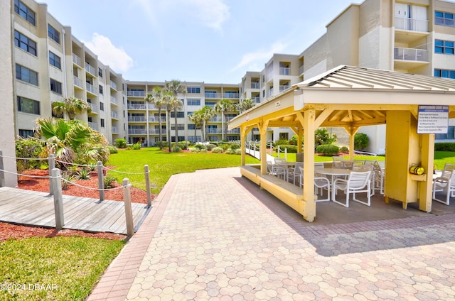 view of community featuring a yard and a gazebo