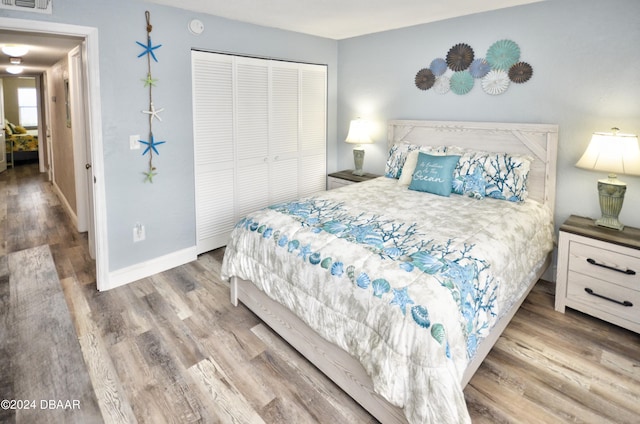 bedroom featuring a closet and hardwood / wood-style floors