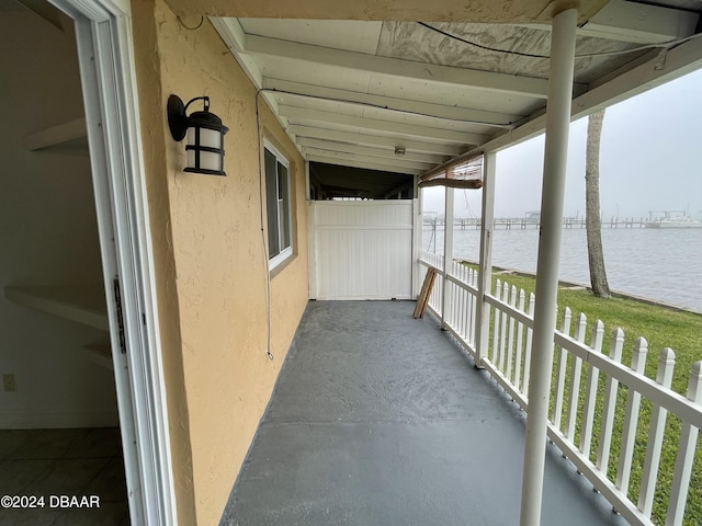 view of patio with a water view