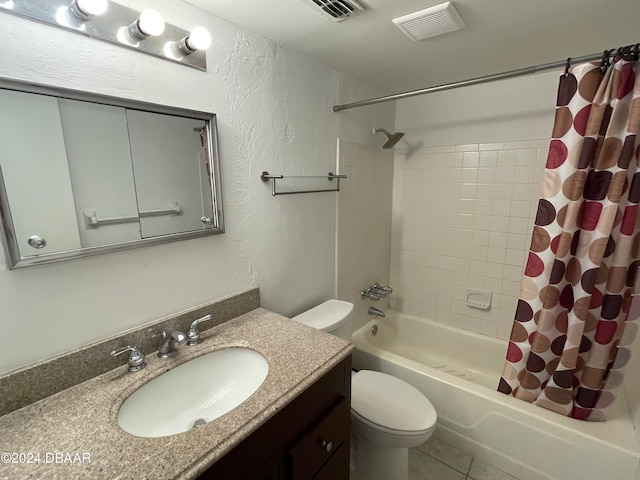 full bathroom featuring vanity, toilet, tile patterned flooring, and shower / bath combo