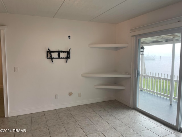 unfurnished dining area with light tile patterned floors