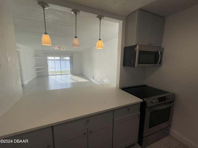 kitchen with stainless steel appliances, gray cabinets, and decorative light fixtures