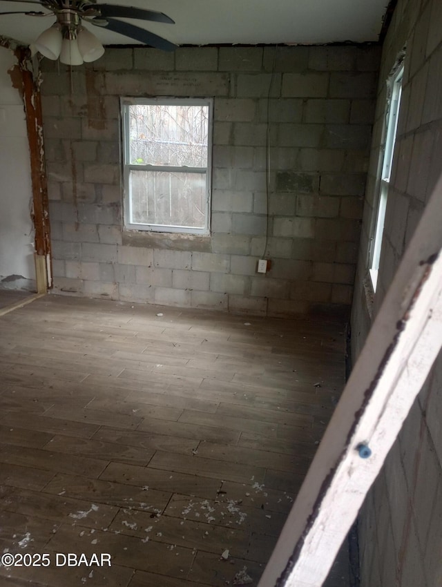 spare room featuring wood-type flooring and ceiling fan