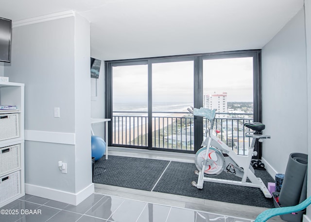 miscellaneous room featuring tile patterned flooring and floor to ceiling windows