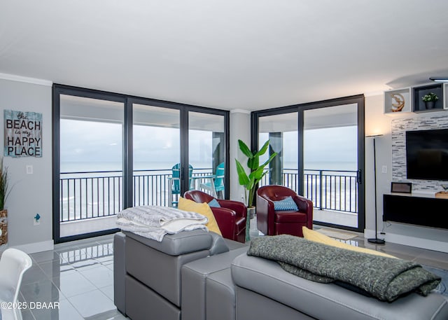 tiled living room featuring ornamental molding and a water view