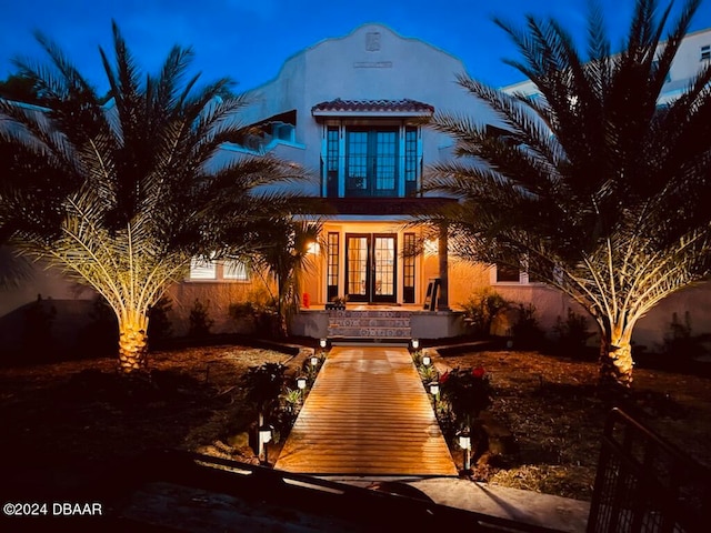 back of house featuring french doors