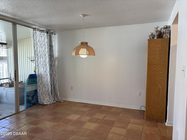 5500 Ocean Shore Blvd Unit 18, Ormond Beach, FL 32176 - unfurnished room featuring baseboards and a textured ceiling