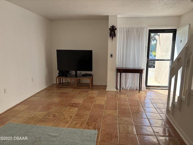 5500 Ocean Shore Blvd Unit 18, Ormond Beach, FL 32176 - entryway featuring tile patterned floors, baseboards, and a textured ceiling