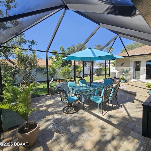 64 Alberta Ave, Ponce Inlet, FL 32127 - view of patio / terrace featuring glass enclosure and outdoor dining space